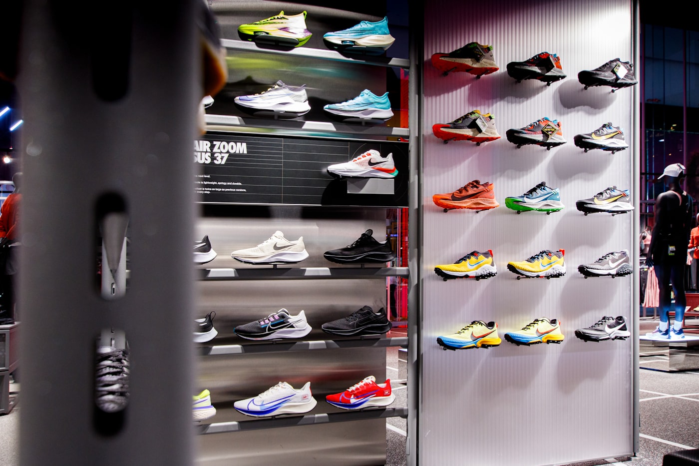 Running shoes on the shelves inside a sportswear store